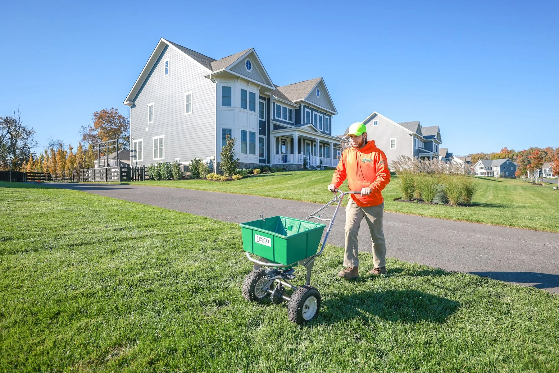 lawn care expert applies lime
