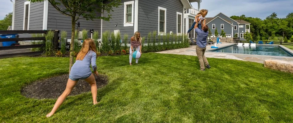 Family enjoying a healthy lawn in Leesburg, VA.
