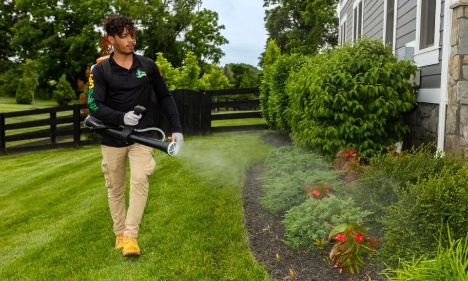 Spraying mosquito control repellent at home in Ashburn, VA.